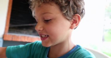 Little boy eating pancake