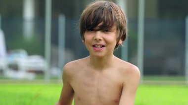 Portrait of kid roaring to camera