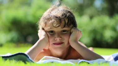Portrait of child smiling outdoors. Handsome young boy outside