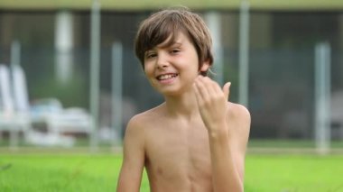 Portrait of handsome child boy outdoors