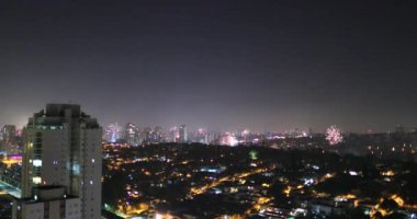 New Year Eve fireworks exploding seen from rooftop. Firework explosion