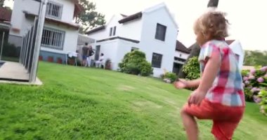 Toddler boy running outdoors