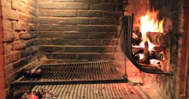 Traditional Uruguyan parilla burning