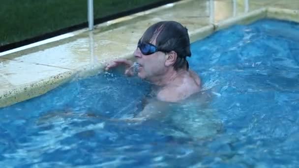 Older Man Swimming Pool Holding Poolside Breathing Deeply — Stockvideo
