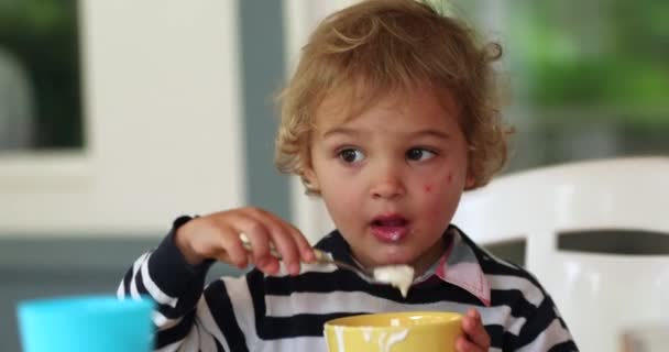 Little Boy Eating Yogurt Breakfast — Stok video