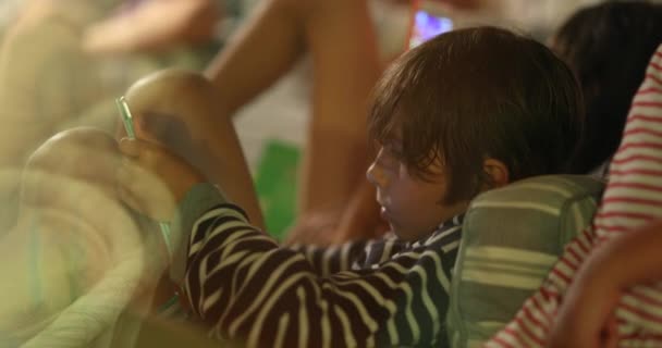 Candid Child Using Tablet Tech Device Night — стоковое видео