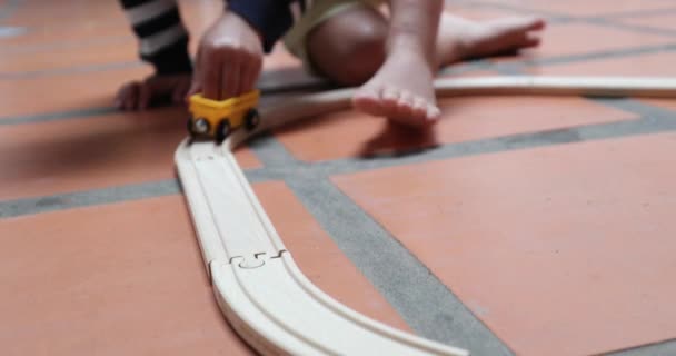 Child Hand Holding Toy Car Wooden Roads — 图库视频影像