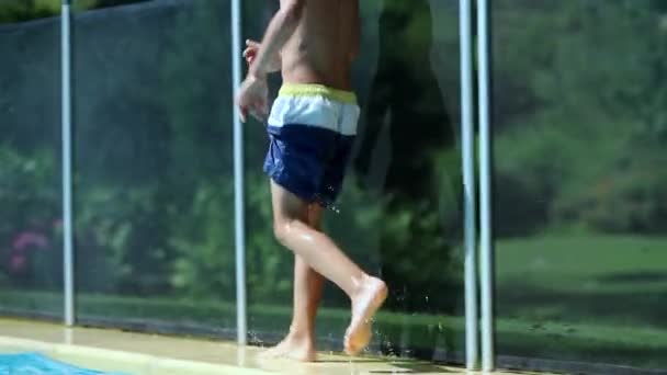 Child Boy Running Poolside Slow Motion Young Boy Runs Side — стоковое видео