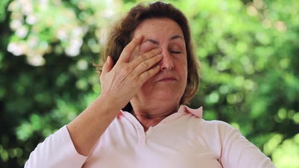 Tired Older Woman Rubbing Eye Pensive Woman Thinking — Stockvideo