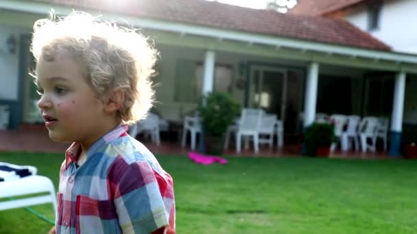 Toddler Baby Boy Portrait Backyard House — Stockvideo