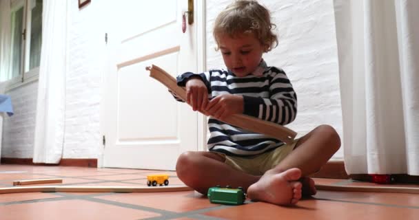 Little Boy Playing Himself Home Indoors — Vídeos de Stock