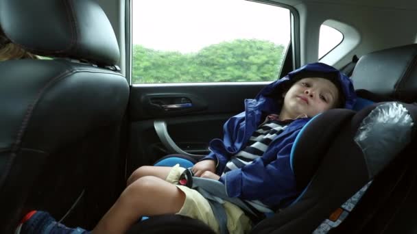 Tired Child Back Seat Car Looking Camera — Vídeo de stock