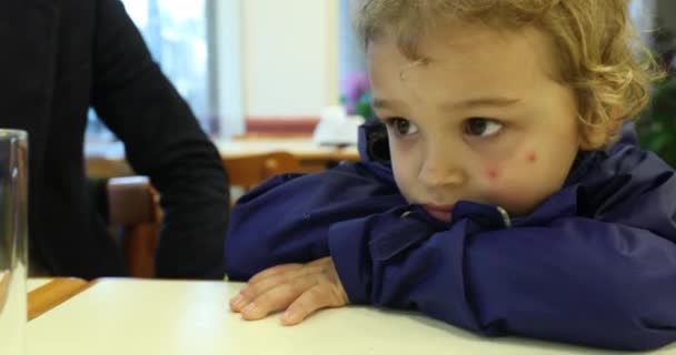 Candid Toddler Boy Looking Wearing Raincoat Observing His Surroundings — Stockvideo