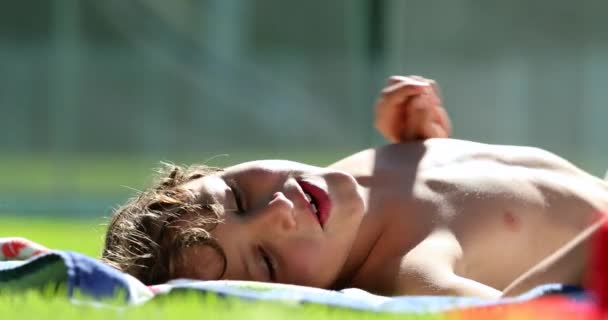 Little Boy Laid Grass Outdoors Candid Casual — Wideo stockowe