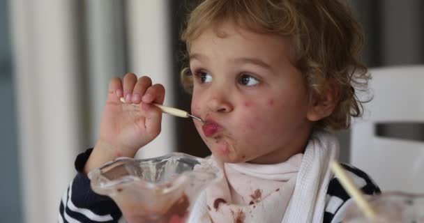 Baby Boy Eating Ice Cream Dessert Doing Funny Grimaces Face — Stockvideo