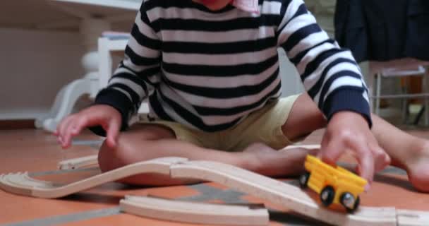 Child Playing Wooden Car Toy Roads — Stock video