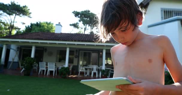 Child Boy Using Tablet Device Tech Outdoor Home Garden — Vídeo de stock