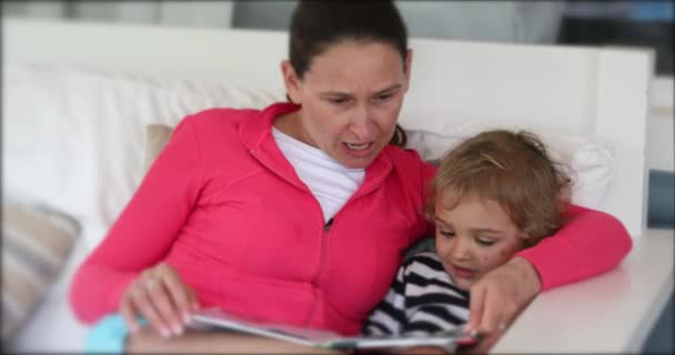 Mother Reading Story Her Child Home Afternoon — Stockvideo