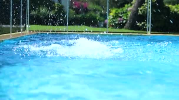 Child Jumping Swimming Pool Water Young Boy Splashes Pool Water — Stockvideo