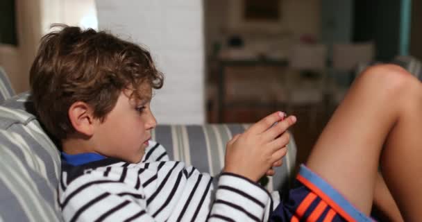 Child Boy Using Smartphone Device Browsing Internet Playing Video Game — Video Stock