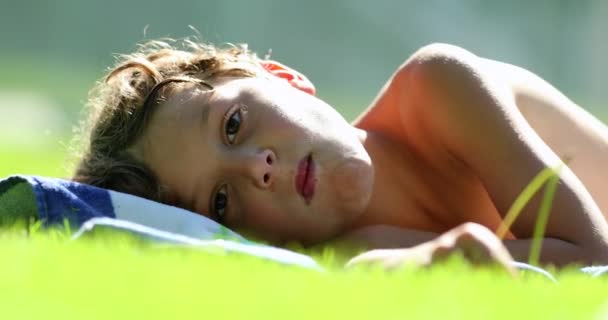 Child Laying Grass Outdoors Little Boy Portrait Daydreaming — Vídeos de Stock