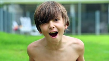 Kid screaming from top of his lungs to camera in slow-motion