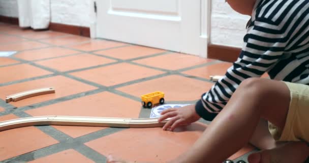 Child Boy Plays Wooden Car Toys — Vídeo de Stock