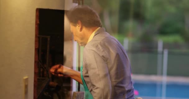 Candid Senior Man Preparing Bbq Grill Home Patio — Video