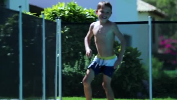 Candid Young Boy Running Poolside Swimming Pool Setting — Stock videók