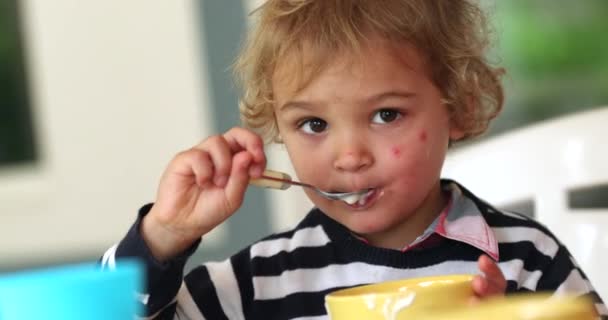 Infant Boy Eating Yogurt Breakfast — Stockvideo