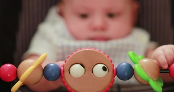 Newborn Baby Playing Chair Toy — Stockvideo