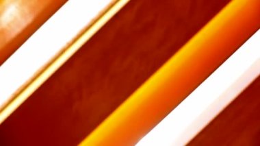 Patterns of light in yellow colorful effect background with sunlight lens-flare passing by