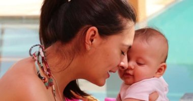 Mother showing love and affection to her newborn baby