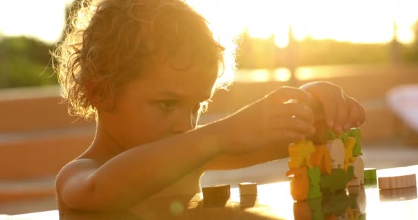 Small Boy Playing Toys Sunlight Outdoors — Video