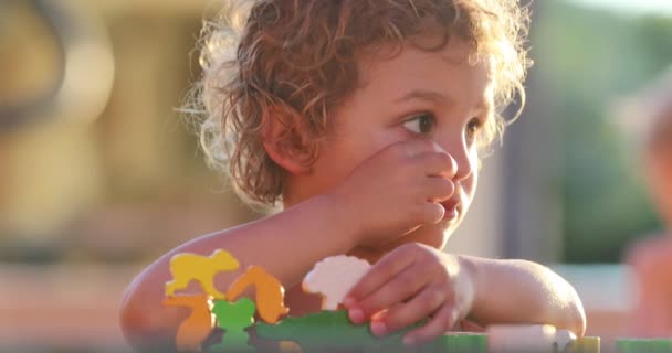 Toddler Boy Playing Puzzle Pieces Thinking Learning — Stock videók