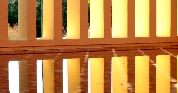 Architecture Orange Patterns Pillars Reflected Water Surface — Stockvideo