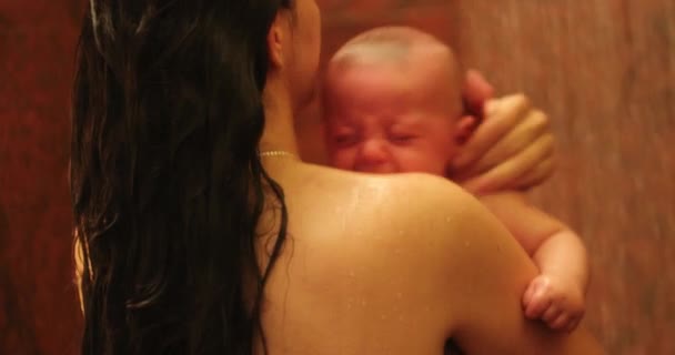 Bathing Washing Crying Newborn Baby Mother Holding Son Shower — Stock video