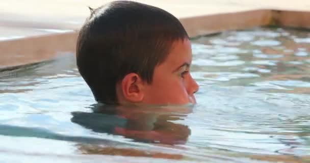Little Boy Swimming Pool Water Daydreaming Playing Himself — Stock Video