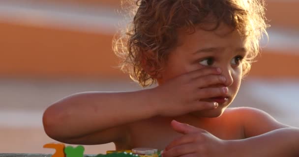 Little Boy Concentraing Rubbing Eye Thinking Playing Toys — Stock videók