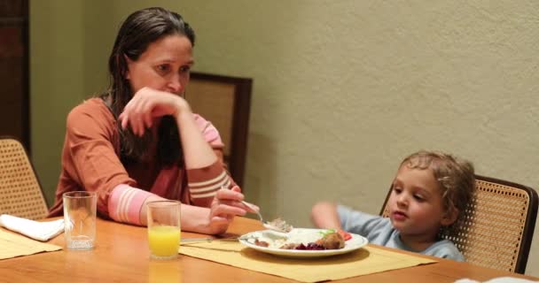 Mother Feeding Her Little Boy Son Dinner Supper — стоковое видео