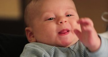 Cute adorable infant baby face smiling