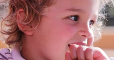 Excited little boy removing color pen cap preparing to draw
