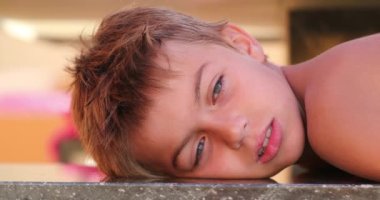 Handsome child young small boy looking to camera outdoors3