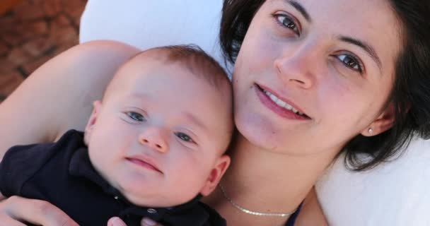 Mother Holding Baby Infant Layed Looking Camera — Videoclip de stoc