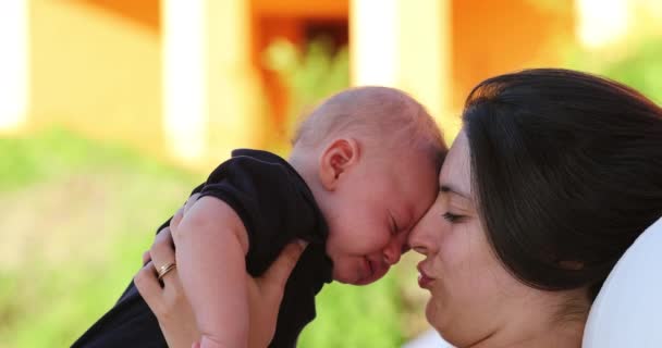 Mom Calming Crying Baby Infant Outdoors Showing Love Affection Care – Stock-video