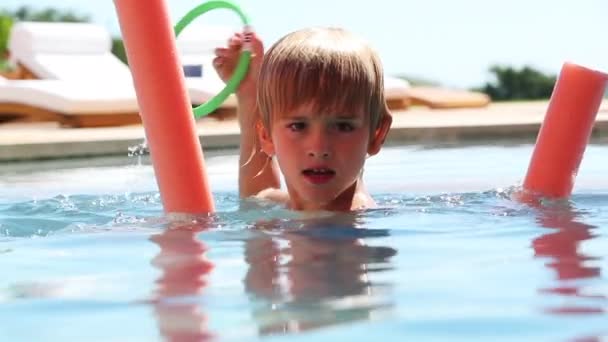 Young Boy Swimming Pool Water Playing Noodle — Video