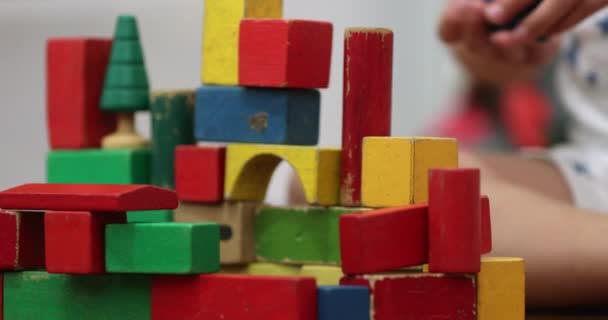 Child Hands Stacking Wooden Toy Building Blocks — Stock Video