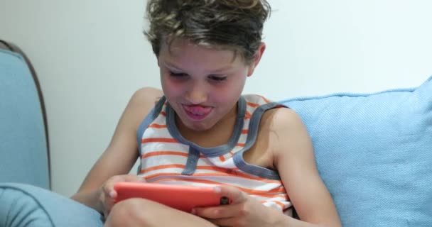 Child Holding Smartphone Playing Video Game Night — Stockvideo