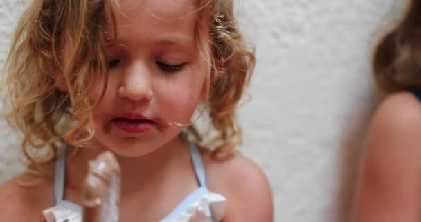 Candid Small Girl Eating Chocolate Ice Cream — 비디오