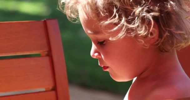 Portrait Cute Little Blonde Boy Eating Melon Fruit Outdoors — Stok video
